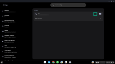 The arrow next to the Wi-FI network name in Settings highlighted.